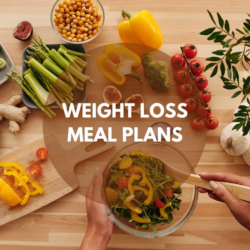 a person mixing a salad with vegetables presenting weighloss meal or diet paln